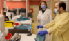 Dr. Mari DeMarco and medical lab technologist Danny Koder reviewing analysis of a patient’s sample being tested for Alzheimer’s disease biomarkers at St. Paul’s Hospital.